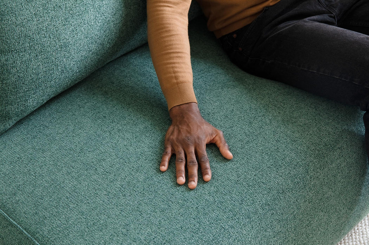 detail of touching on sofa bed