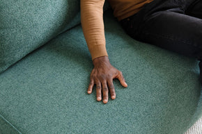 detail of touching on sofa bed