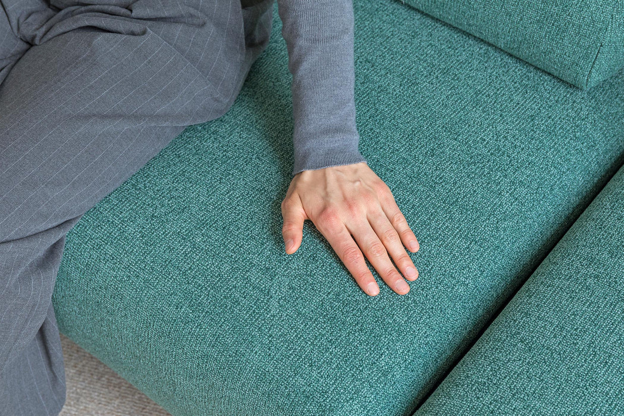 detail of touching on sofa bed