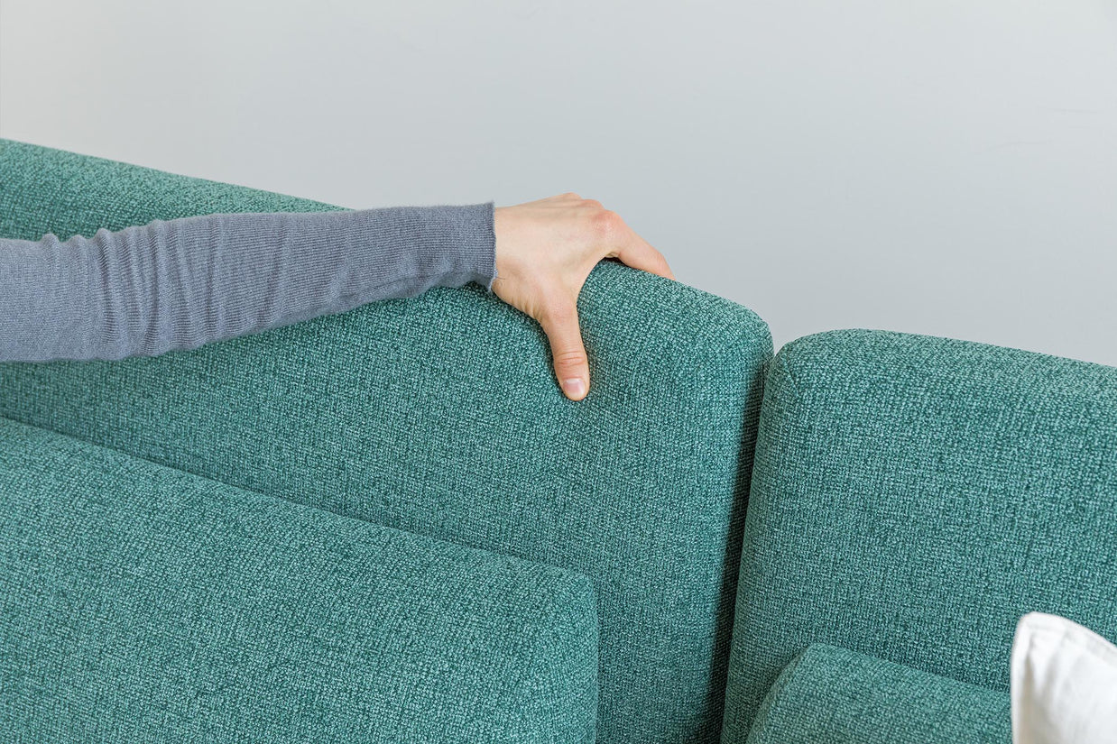 detail  of touching on sofa bed