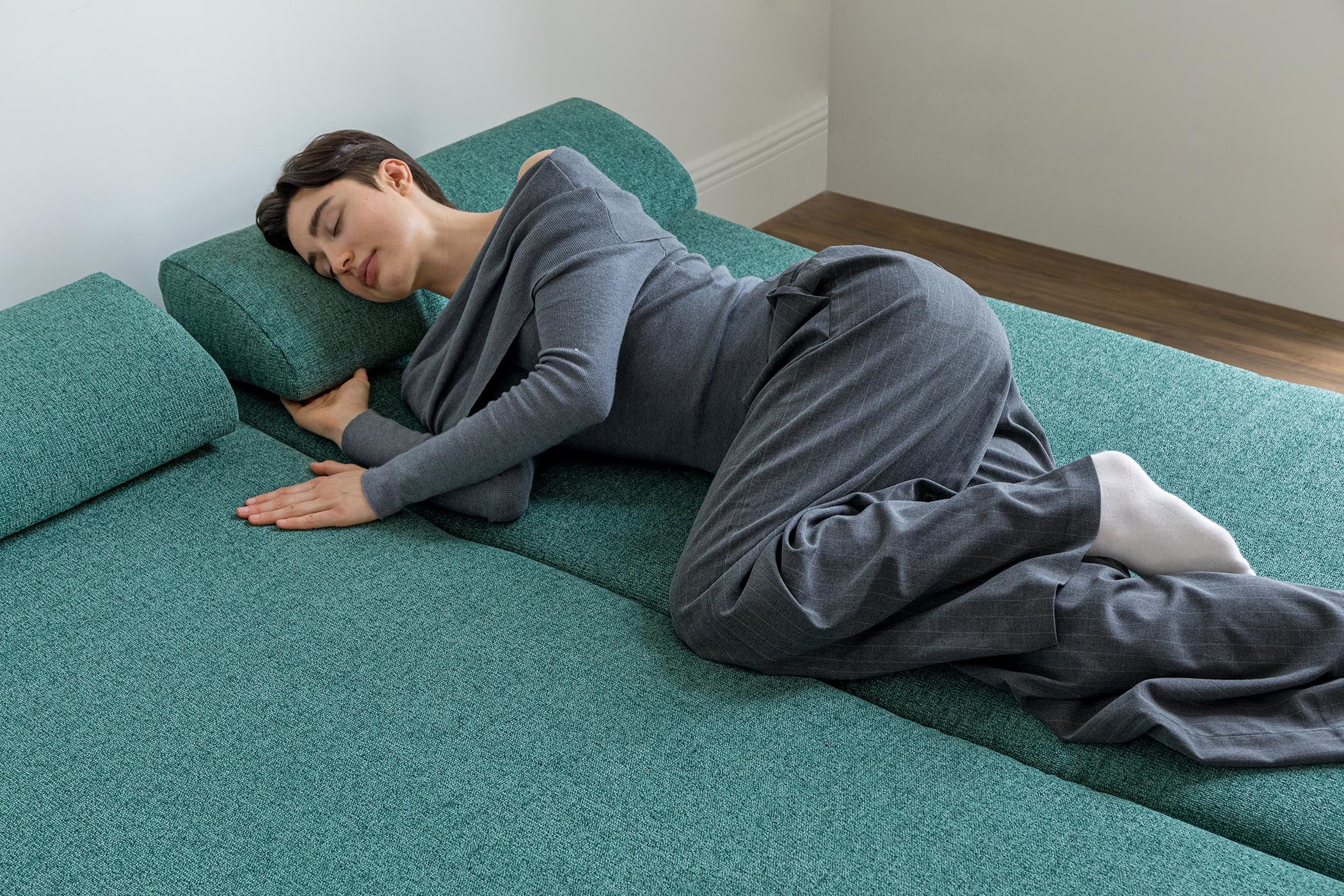 detail of model sleeping on sofa bed