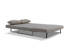 sofa bed in bed mode- side view on white background