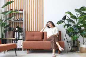  model sitting on the sofa bed in living room