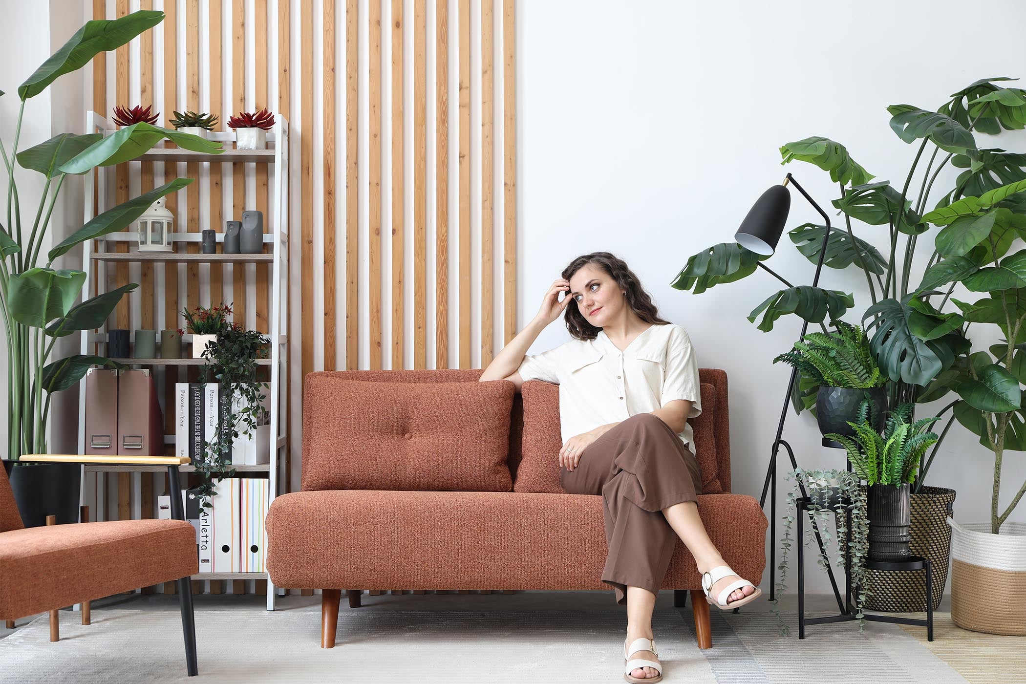  model sitting on the sofa bed in living room