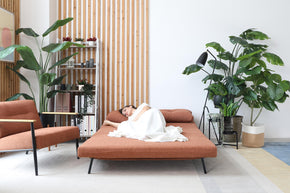  model sleeping on the sofa bed in living room