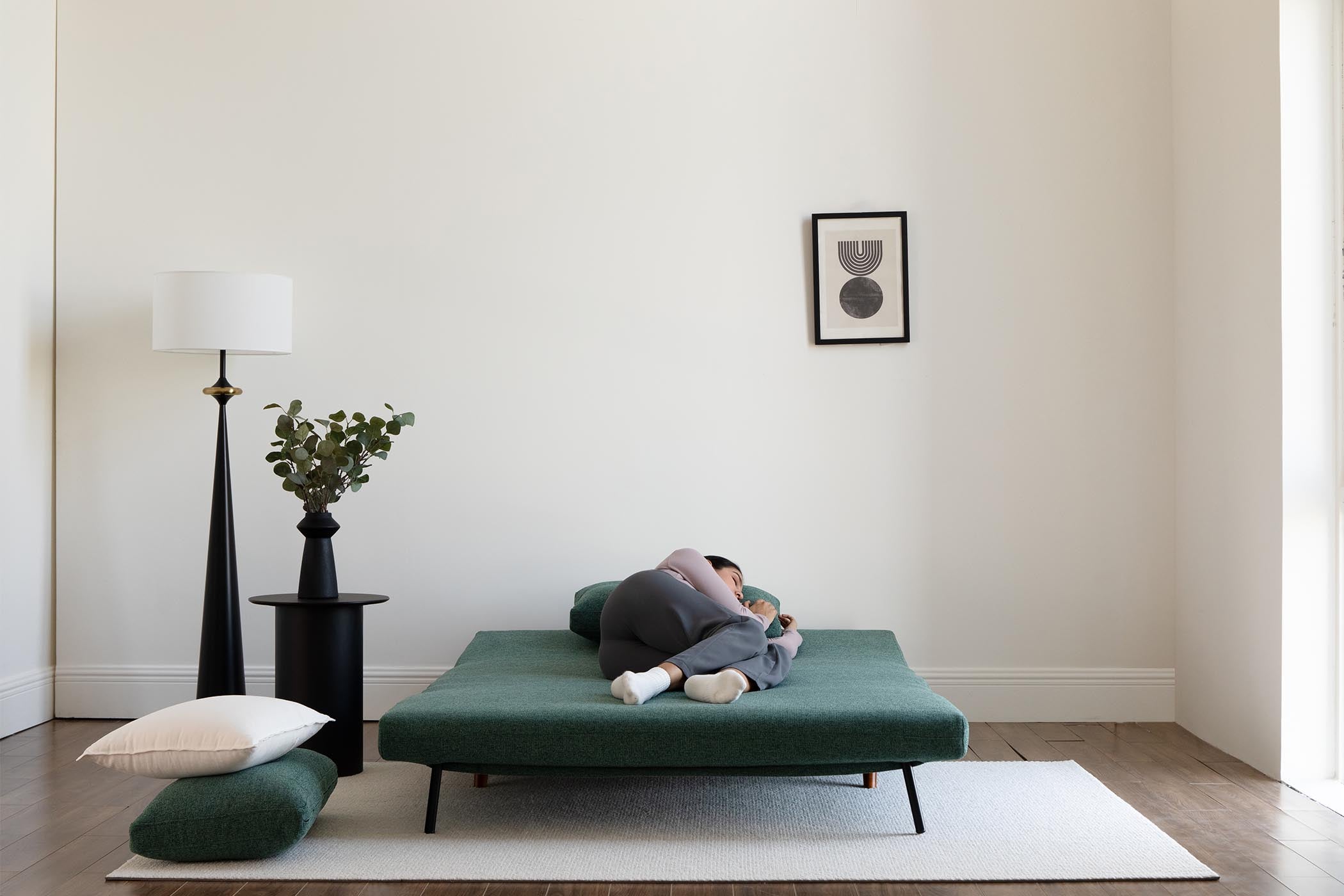 model sleeping on bed scene display