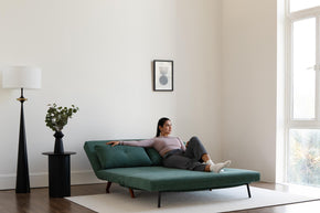 model enjoying sofa bed scene display