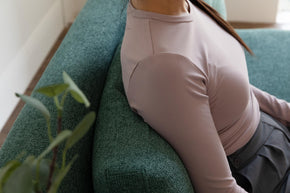 detail of model sitting on sofa bed