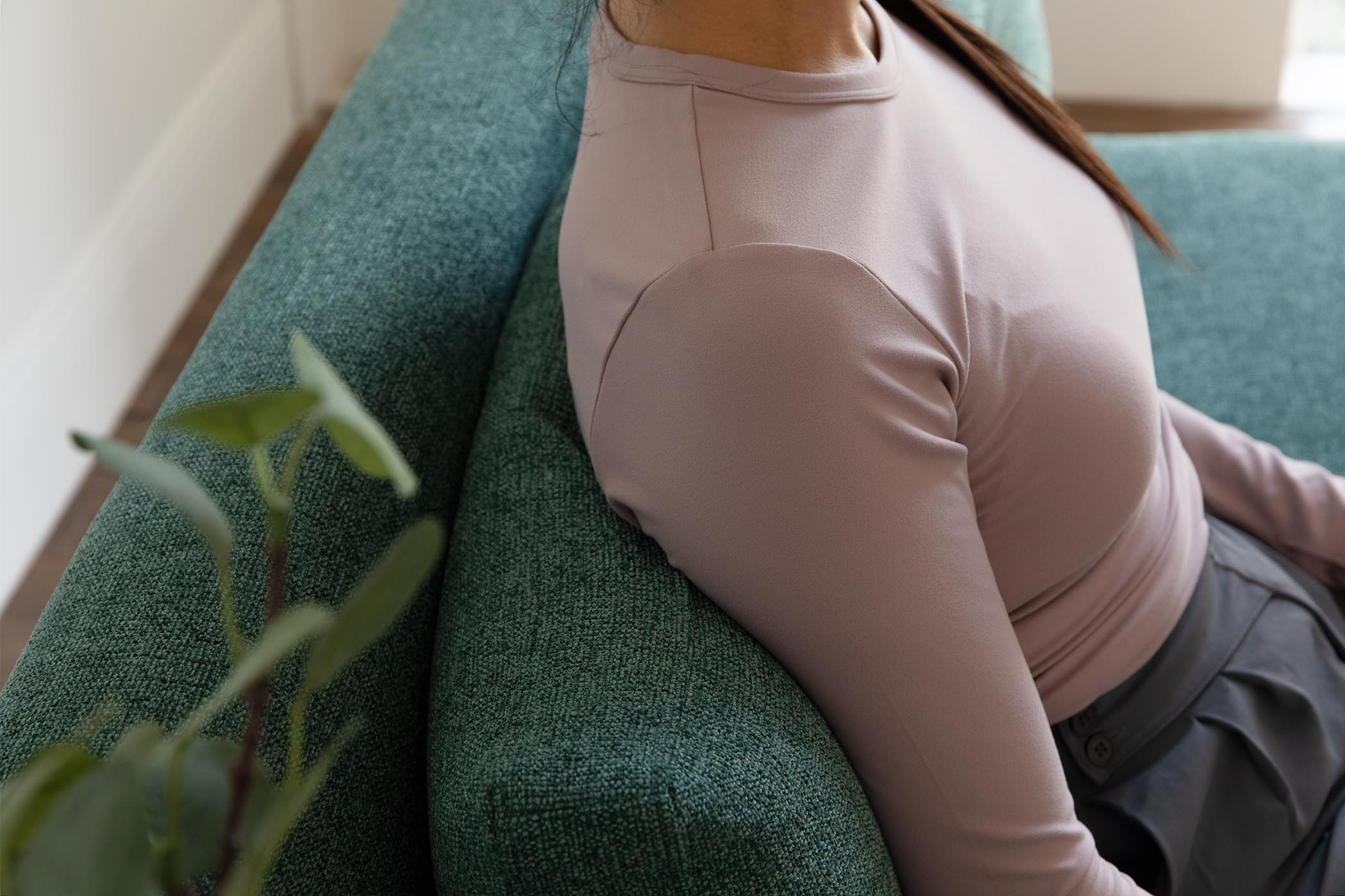 detail of model sitting on sofa bed