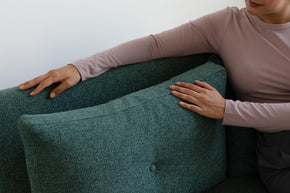 detail of model touching sofa bed